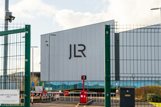 Wolverhampton, UK - February 22 2025: Jaguar Land Rover motor company logo and name outside of a car engine factory
