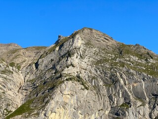 Rocky alpine peaks above Lake Melchsee or Melch Lake in the Uri Alps mountain massif, Kerns - Canton of Obwalden, Switzerland (Kanton Obwald, Schweiz)