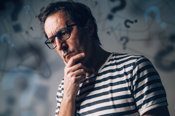 Overthinking and overanalyzing or analysis paralysis concept, perplexed anxious man