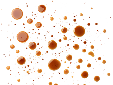Scattered tea or coffee stains and droplets in various sizes, abstract pattern, isolated on white background