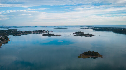 Aerial view of small islands in a calm bay with sailboats, Cape Cod, USA.