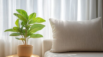 A vibrant plant rests on a table beside a cozy couch, enhancing the living space with its natural beauty and inviting atmosphere.