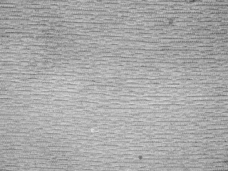 Close-up of a light gray fabric with a fine texture, ideal for backgrounds.