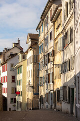 Switzerland, Zurich. Old town Altstadt architecture. Traditioanl buildings on a narrow alley.