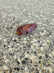 Dates in a bowl on a wooden background. Dried fruits. Dried date fruit. PNG, Ramadan. Organic dried medium fruit snack. Dried date palm.