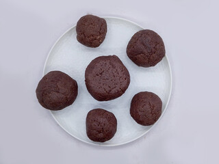 Deliciously Cooked Finger Millet Balls on a White Background. Nutritious Finger Millet Balls (Ragi Mudde) Served on a Clean White Background. Freshly Cooked Finger Millet Balls on a Minimalist White