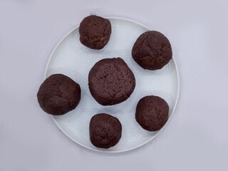 Deliciously Cooked Finger Millet Balls on a White Background. Nutritious Finger Millet Balls (Ragi Mudde) Served on a Clean White Background. Freshly Cooked Finger Millet Balls on a Minimalist White