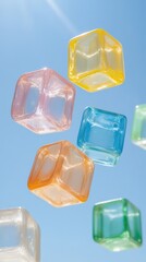 Colorful plastic cubes float against a blue sky, creating a vibrant and playful atmosphere that evokes creativity and imagination.