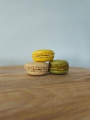 Pastel macaroons on backdrop. Macaron Cake Isolated, Macaron Cookie, Almond Lemon, Sweet Pasta, Colorful French Dessert on Background. Delicious colorful macarons. Classic Vanilla Macaroon Cookiesasso