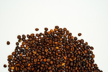 Coffee beans on a white background. Close-up. Space for text