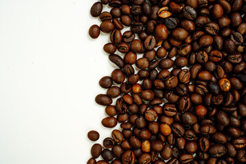 Coffee beans on a white background. Close-up. Space for text