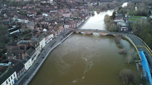 Aerial view of flooded river through Bewdley town in winter with leafless trees in England