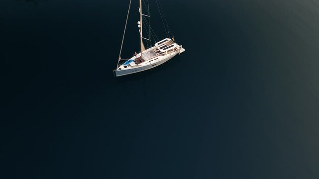Aerial footage of sailboats in still blue waters on Symi island in Greece