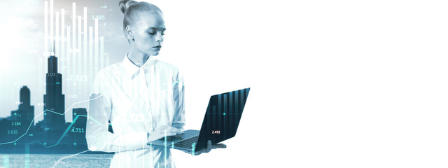 Businesswoman using laptop with financial data overlay on city skyline background.