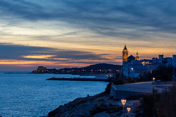 Fototapeta premium Sunset in a coastal town in front of the sea