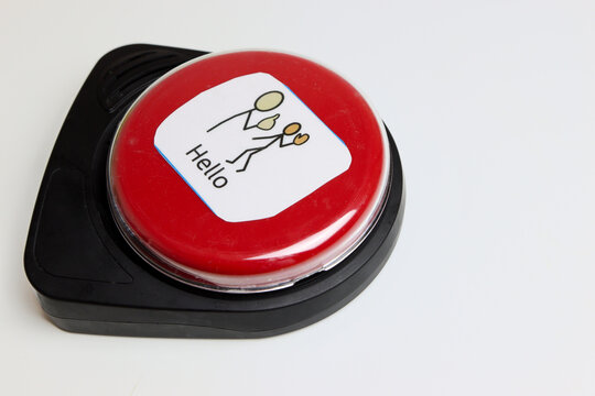 red button communication device for non verbal people, saying hello - Powered by Adobe