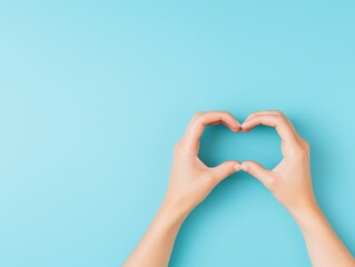 Fototapeta premium Soft and well-manicured hands forming a heart, representing gratitude, care, and emotional warmth in a simple yet powerful image
