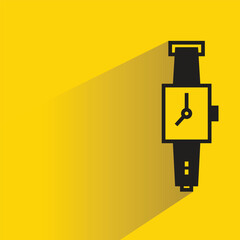 watch with shadow on yellow background