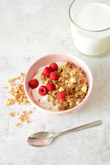 Yogurt with Granola and Raspberries vertical photo