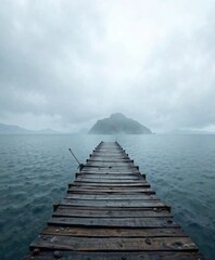 Obraz premium Weathered wooden pier jutting into the cloudy Black sea of Adler , rugged shoreline, adler