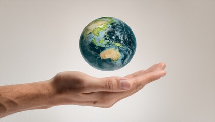 거대한 손 위에 떠 있는 작은 지구