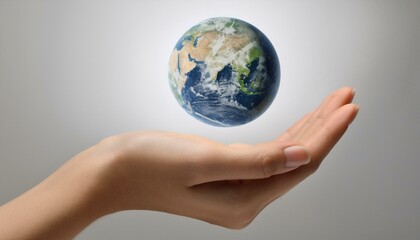 거대한 손 위에 떠 있는 작은 지구