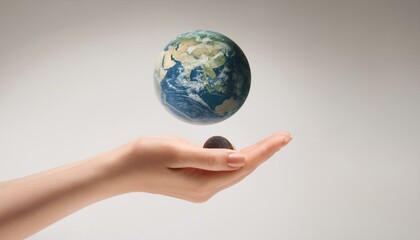 거대한 손 위에 떠 있는 작은 지구