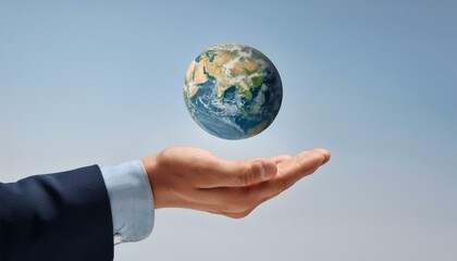 거대한 손 위에 떠 있는 작은 지구