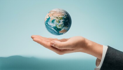 거대한 손 위에 떠 있는 작은 지구