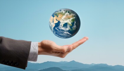 거대한 손 위에 떠 있는 작은 지구