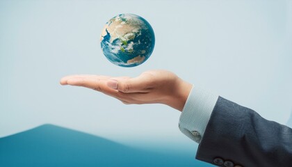 거대한 손 위에 떠 있는 작은 지구