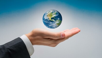 거대한 손 위에 떠 있는 작은 지구