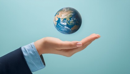 거대한 손 위에 떠 있는 작은 지구