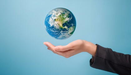 거대한 손 위에 떠 있는 작은 지구