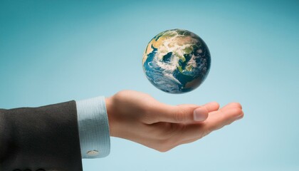 거대한 손 위에 떠 있는 작은 지구