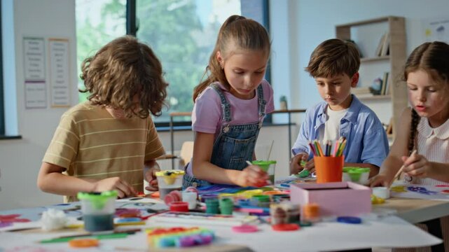 Kids engaged art activity at elementary school artclass closeup. Group children