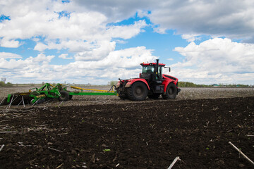 Fototapeta premium Versatile cultivator with disk, cultivate, harrow tools for secondary tillage