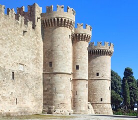 Exterior view of the Palace of the Grand Master of the Knights of Rhodes, a castle restored in 1940 by the Italians, now housing museums showcasing ancient and medieval Rhodes history.