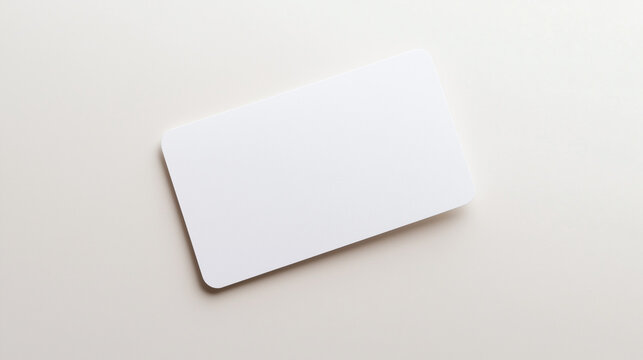 Blank white card on a flat surface, symbolizing simplicity and clarity in design