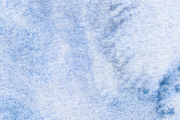 Close-up of blue textured canvas with soft patterns and abstract shadows creating a dreamy artistic background.