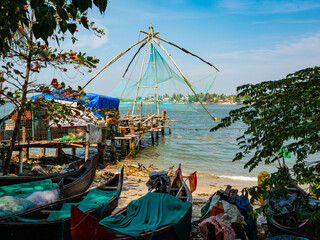 Chinese-style fishing nets, made from teak and bamboo, counterweighted by rocks, on the shoreline of Fort Kochi, a district of Kochi city in Kerala, southern India.