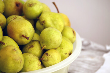 natural winter pears, natural ripe pears without hormones, in a large bowl on the balcony,