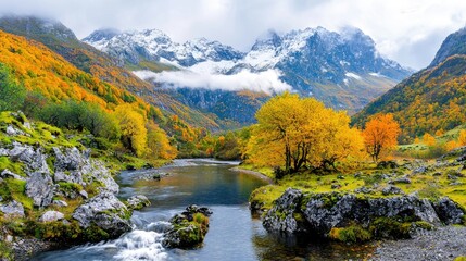 Obraz premium Autumn Mountain River Valley with Snowcapped Peaks