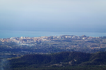 The panorama opening from the pick Puig Camapan in the direction of Benidorm and sea, Spain 