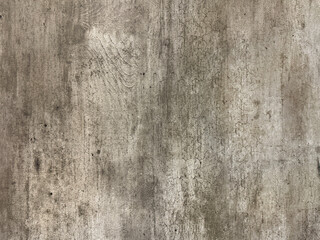 Close up of weathered concrete wall, with grunge, dirt, and bark texture. Seamless background texture.