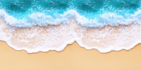 Fototapeta premium Aerial view of a serene beach showcasing a gentle wave approaching the sandy shore under clear blue skies.