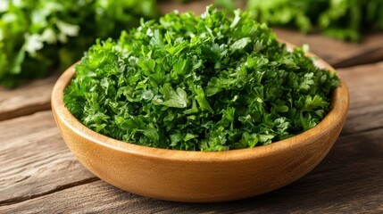 Fototapeta premium A close-up view of fresh parsley leaves arranged in a bowl, placed elegantly on a rustic wooden table, showcasing its vibrant green color.