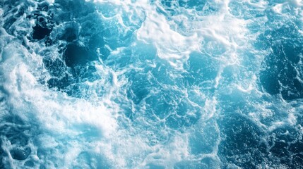 Background of water waves in a blue color with white foam and splashes. 