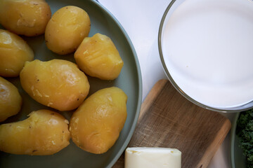 top view of boiled potatoes in a green ceramic plate