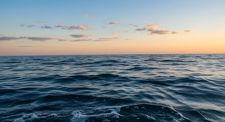 Fototapeta premium ocean waves at sunset with sky reflections